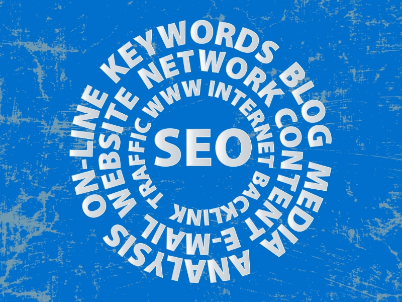 A word cloud in the shape of a circle with a blue background: SEO, Traffic, WWW, Internet, Backlink, Website, Network, Content, E-Mail, On-Line, Keywords, Blog, Media, Analysis.